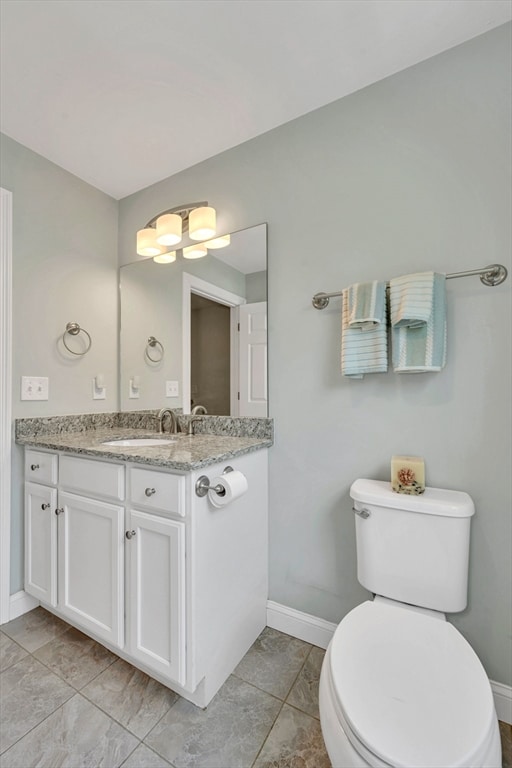 1400 Gorham Unit 3, Lowell, MA 01852 - bathroom with baseboards and vanity