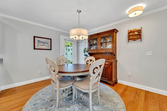 1400 Gorham Unit 3, Lowell, MA 01852 - dining space with a chandelier, ornamental molding, and light wood finished floors