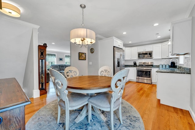 1400 Gorham Unit 3, Lowell, MA 01852 - dining space featuring light wood finished floors, a chandelier, recessed lighting, and crown molding