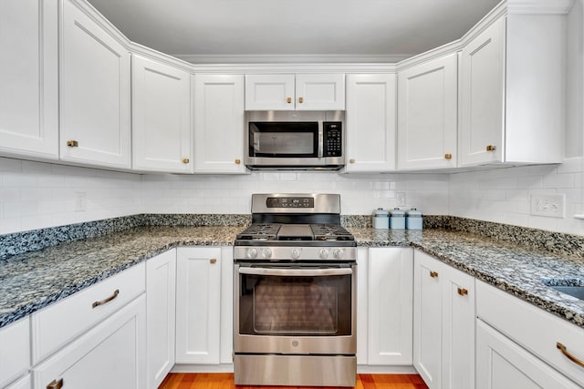 1400 Gorham Unit 3, Lowell, MA 01852 - kitchen featuring stainless steel appliances, white cabinetry, and backsplash