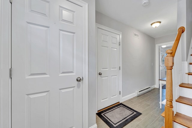 1400 Gorham Unit 3, Lowell, MA 01852 - entrance foyer with a baseboard heating unit, stairs, and wood finish floors