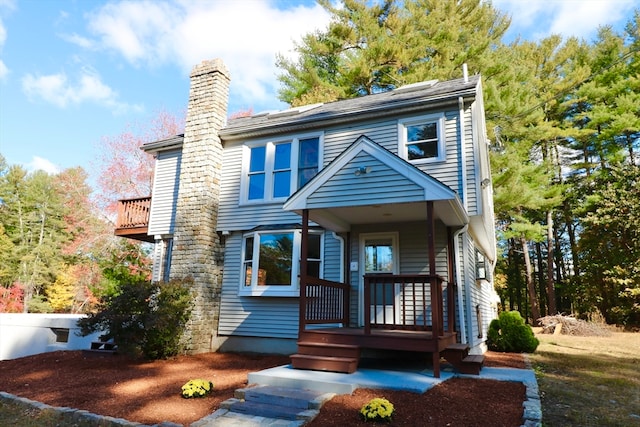 view of front of home featuring a balcony