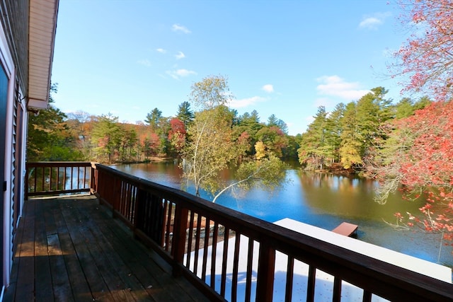 wooden deck featuring a water view