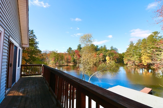 wooden terrace featuring a water view