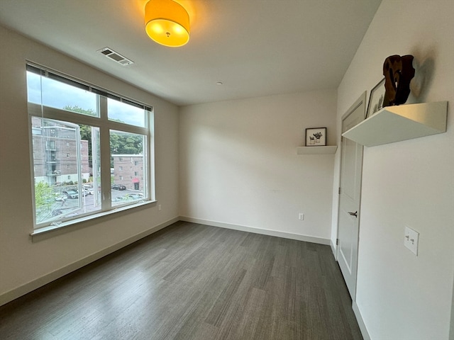 empty room with wood-type flooring