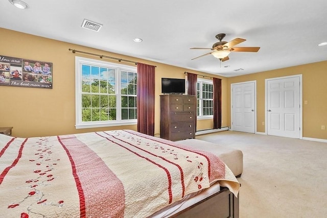 bedroom with multiple windows, a baseboard radiator, baseboards, carpet floors, and recessed lighting