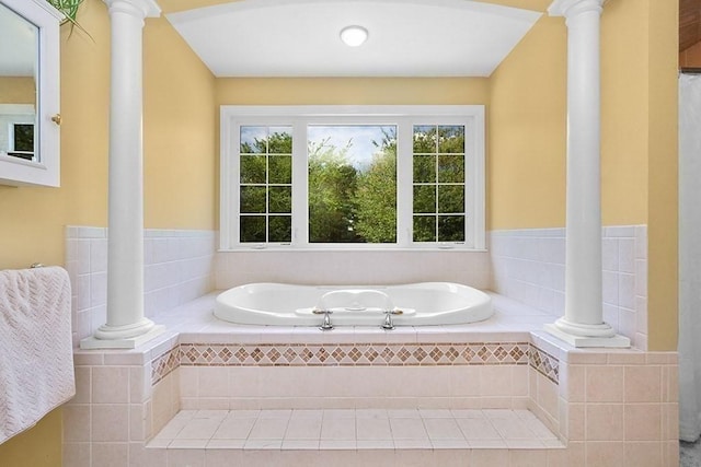full bath with a garden tub and decorative columns