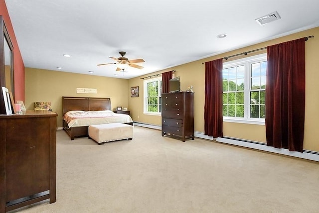 carpeted bedroom featuring a baseboard heating unit, recessed lighting, ceiling fan, and baseboards