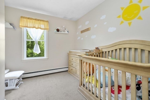bedroom featuring a baseboard radiator, carpet floors, and a nursery area