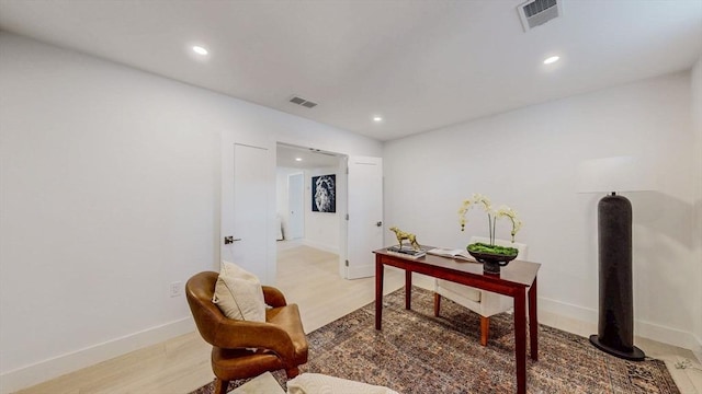 office area featuring recessed lighting, light wood-type flooring, and baseboards