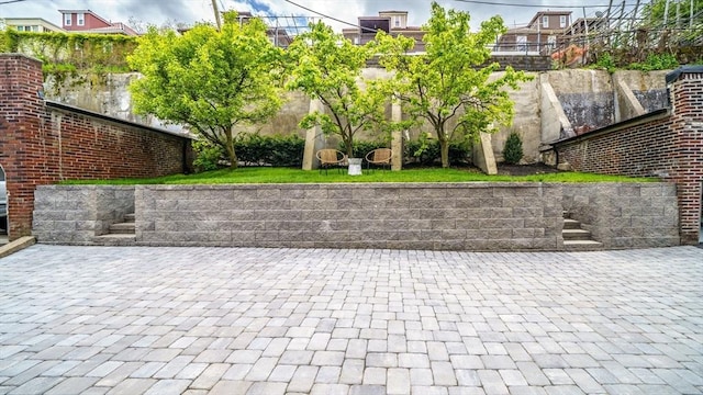 surrounding community featuring fence and a patio area