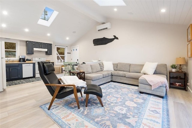 69 Naugus Ave, Marblehead, MA 01945 - living room featuring a skylight, light wood-style floors, a wall mounted AC, and recessed lighting