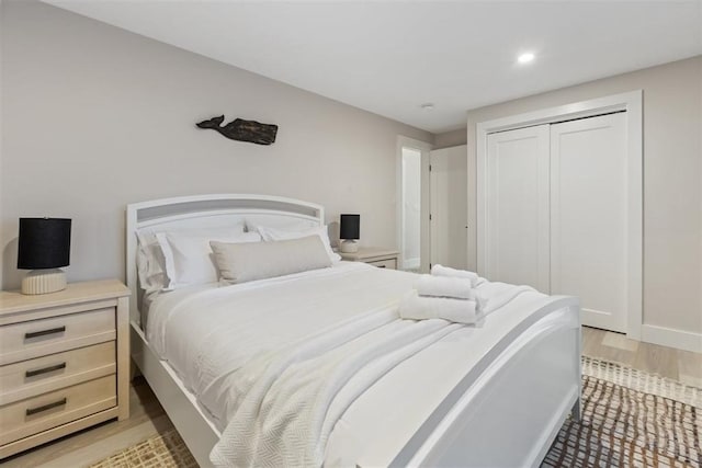 69 Naugus Ave, Marblehead, MA 01945 - bedroom featuring light wood-style flooring, a closet, recessed lighting, and baseboards