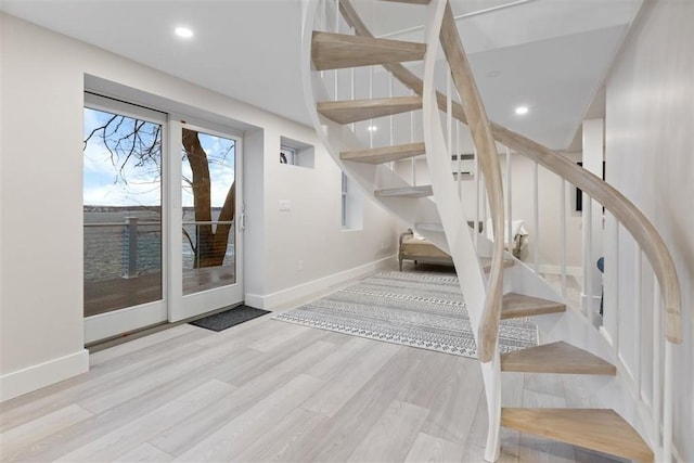 69 Naugus Ave, Marblehead, MA 01945 - stairs featuring wood finished floors, baseboards, and recessed lighting