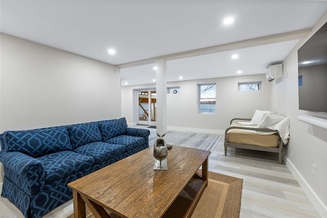 69 Naugus Ave, Marblehead, MA 01945 - living room featuring an AC wall unit, light wood finished floors, recessed lighting, and baseboards
