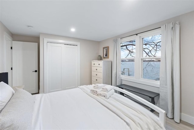 69 Naugus Ave, Marblehead, MA 01945 - bedroom with a closet, light wood finished floors, baseboards, and recessed lighting