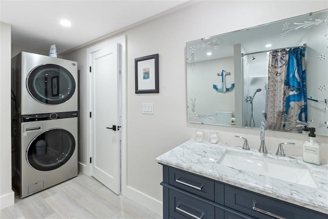 69 Naugus Ave, Marblehead, MA 01945 - laundry area with estacked washer and dryer, baseboards, and recessed lighting