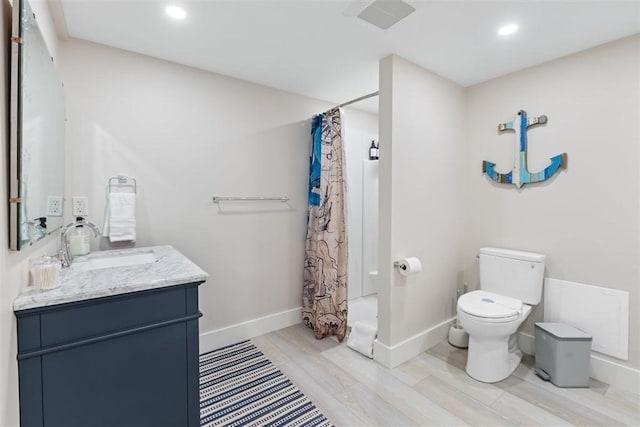 69 Naugus Ave, Marblehead, MA 01945 - bathroom with toilet, vanity, a shower with curtain, baseboards, and recessed lighting