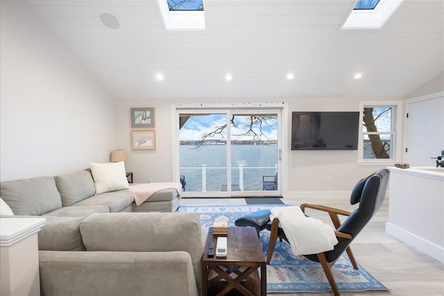 69 Naugus Ave, Marblehead, MA 01945 - living room featuring a skylight, baseboards, light wood finished floors, recessed lighting, and vaulted ceiling