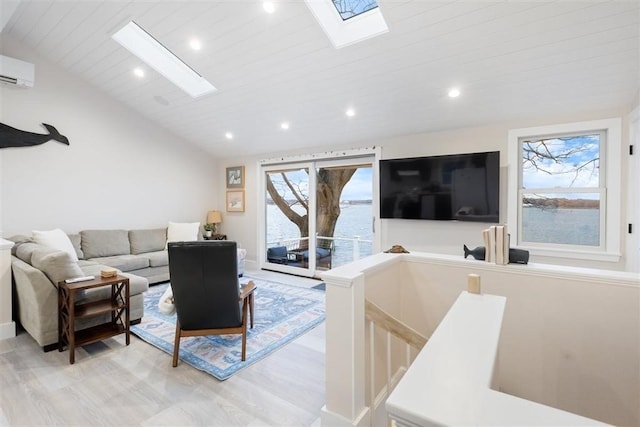 69 Naugus Ave, Marblehead, MA 01945 - living area with a skylight, light wood-style flooring, vaulted ceiling, recessed lighting, and a wall mounted AC