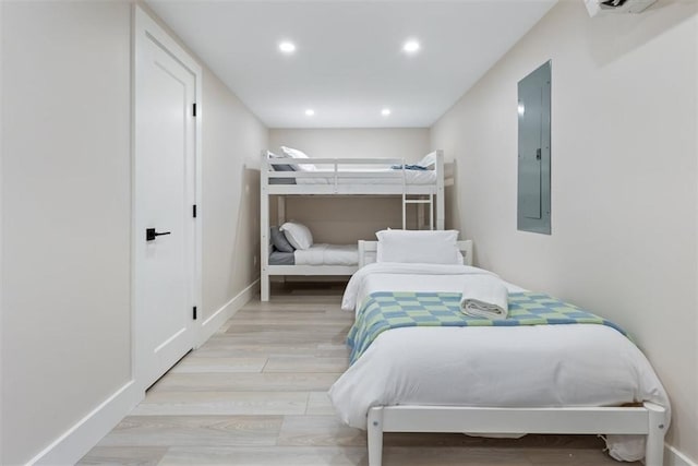 69 Naugus Ave, Marblehead, MA 01945 - bedroom with electric panel, light wood-style floors, recessed lighting, and baseboards