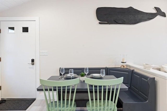 69 Naugus Ave, Marblehead, MA 01945 - dining area with lofted ceiling and wood finished floors