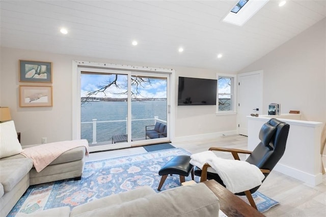 69 Naugus Ave, Marblehead, MA 01945 - living area featuring light wood-style flooring, baseboards, vaulted ceiling, recessed lighting, and a skylight