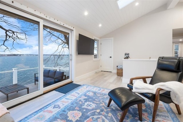 69 Naugus Ave, Marblehead, MA 01945 - living area with vaulted ceiling, light wood finished floors, baseboards, recessed lighting, and a skylight