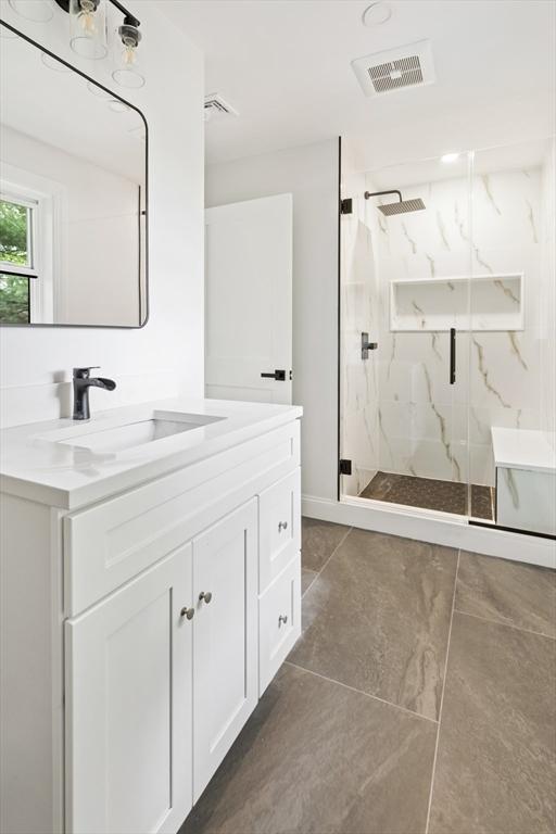 96 Dutton St, Malden, MA 02148 - bathroom with vanity, a marble finish shower, and tile patterned flooring