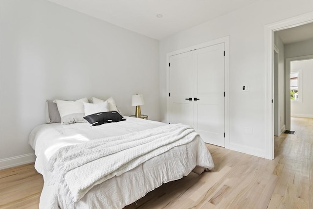 96 Dutton St, Malden, MA 02148 - bedroom featuring light wood-type flooring and a closet