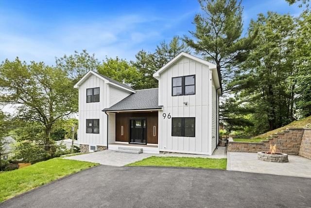 96 Dutton St, Malden, MA 02148 - modern inspired farmhouse featuring board and batten siding, a fire pit, and roof with shingles