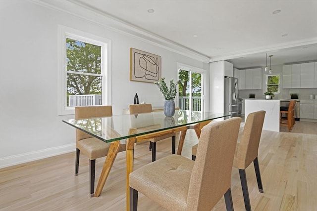 96 Dutton St, Malden, MA 02148 - dining room featuring healthy amount of natural light, ornamental molding, and light wood finished floors