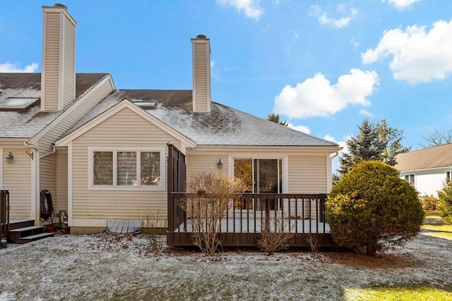 rear view of house with a wooden deck