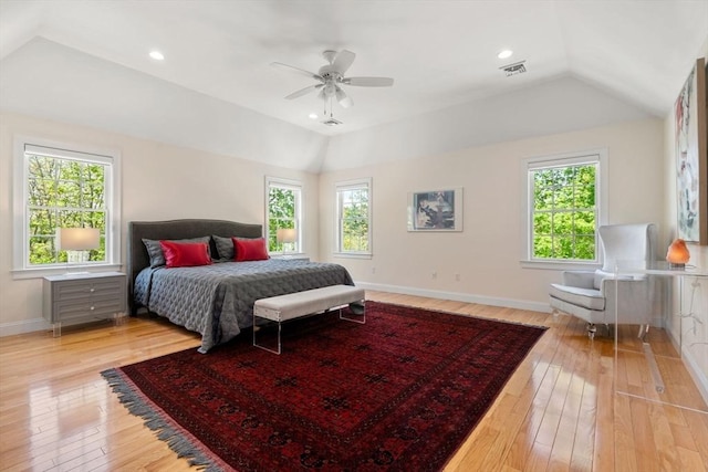 bedroom featuring lofted ceiling, multiple windows, light wood-style floors, baseboards, and recessed lighting