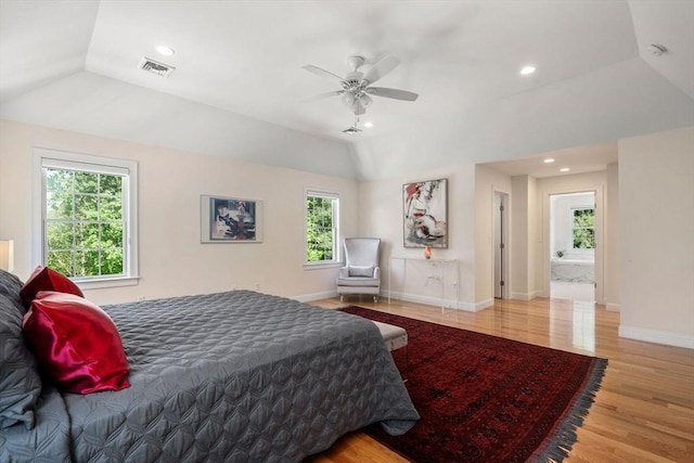 bedroom featuring vaulted ceiling, wood finished floors, baseboards, recessed lighting, and a ceiling fan