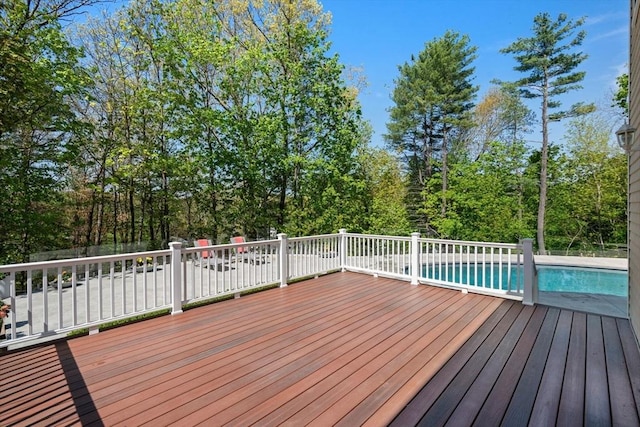 deck with an outdoor pool