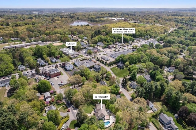 aerial overview of property's location featuring a heavily wooded area