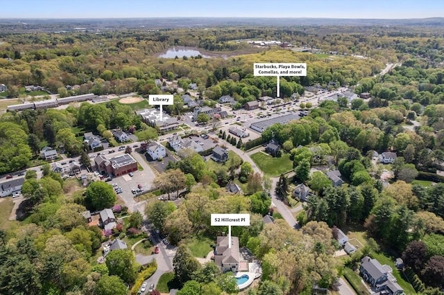view of property location with a heavily wooded area
