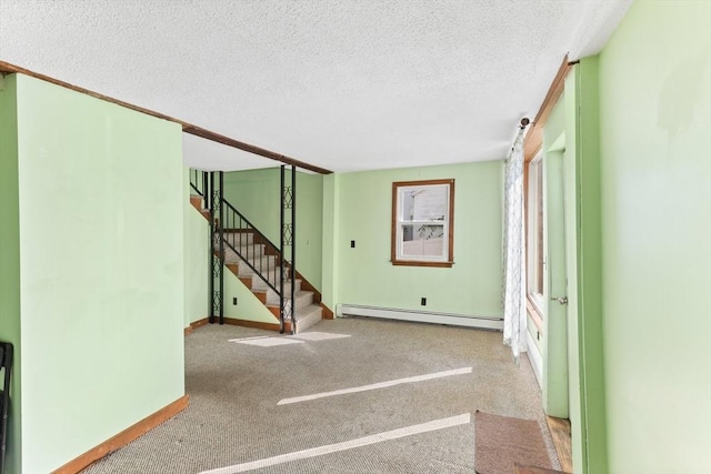 209 S St, Wrentham, MA 02093 - staircase featuring a baseboard heating unit, a textured ceiling, baseboards, and carpet