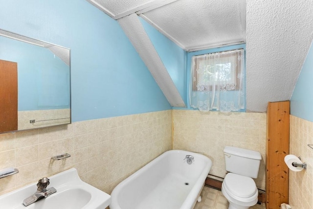 209 S St, Wrentham, MA 02093 - full bathroom with tile walls, a soaking tub, toilet, a sink, and a textured ceiling