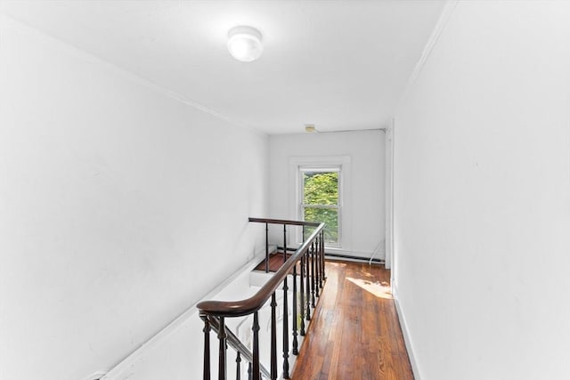 209 S St, Wrentham, MA 02093 - corridor featuring wood-type flooring, an upstairs landing, and ornamental molding