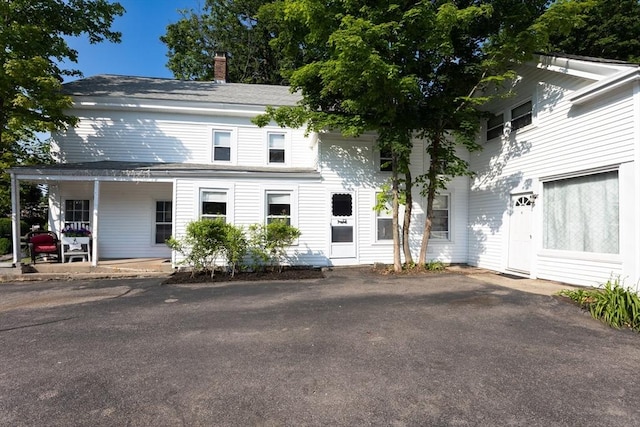 209 S St, Wrentham, MA 02093 - view of front of house featuring covered porch and a chimney