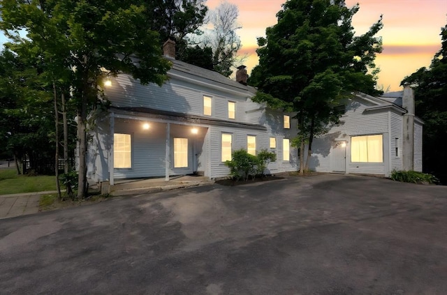 209 S St, Wrentham, MA 02093 - view of front of house with a chimney and a porch