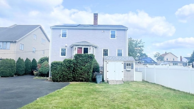 628 Malden St, Revere, MA 02151 - back of house featuring a chimney