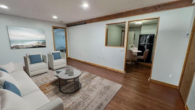628 Malden St, Revere, MA 02151 - living area featuring wood finished floors, baseboards, and recessed lighting