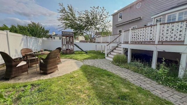 628 Malden St, Revere, MA 02151 - view of yard with a playground and a wooden deck