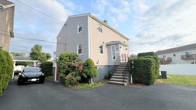 628 Malden St, Revere, MA 02151 - view of front facade with stairway and a chimney