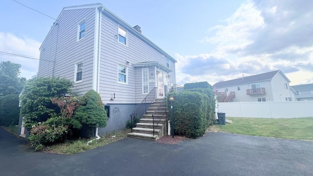 628 Malden St, Revere, MA 02151 - view of property exterior with a chimney and stairs