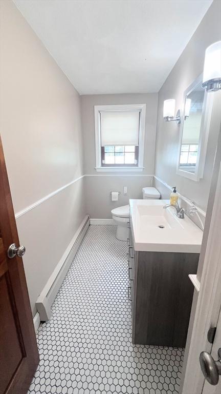 628 Malden St, Revere, MA 02151 - bathroom featuring vanity, toilet, and baseboards