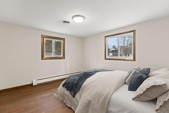 126 Prospect Hill St, Taunton, MA 02780 - bedroom featuring a baseboard heating unit, wood finished floors, and baseboards